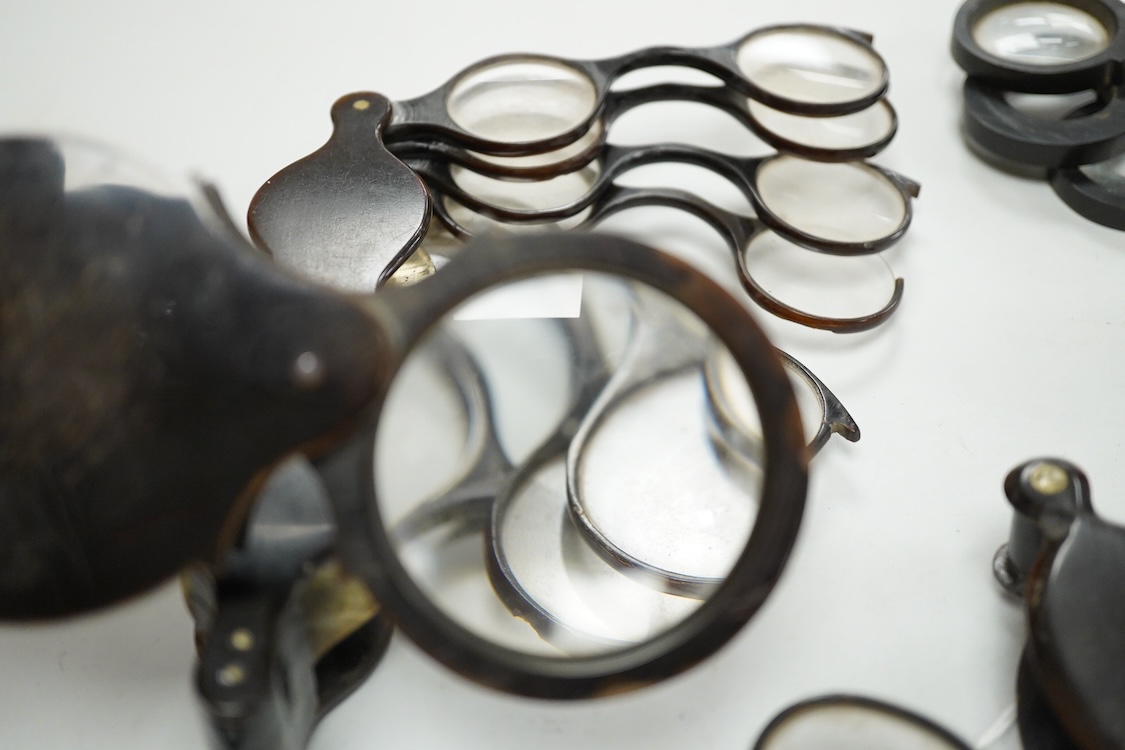 A group of 19th-century horn framed loupes, quizzing glasses and four optician multiple lens sizing lorgnettes (13)